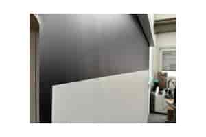 B-Ware celexon GREYVISION Premium Plus Tension Motorleinwand: Leichte Wellen oben links im Tuch
