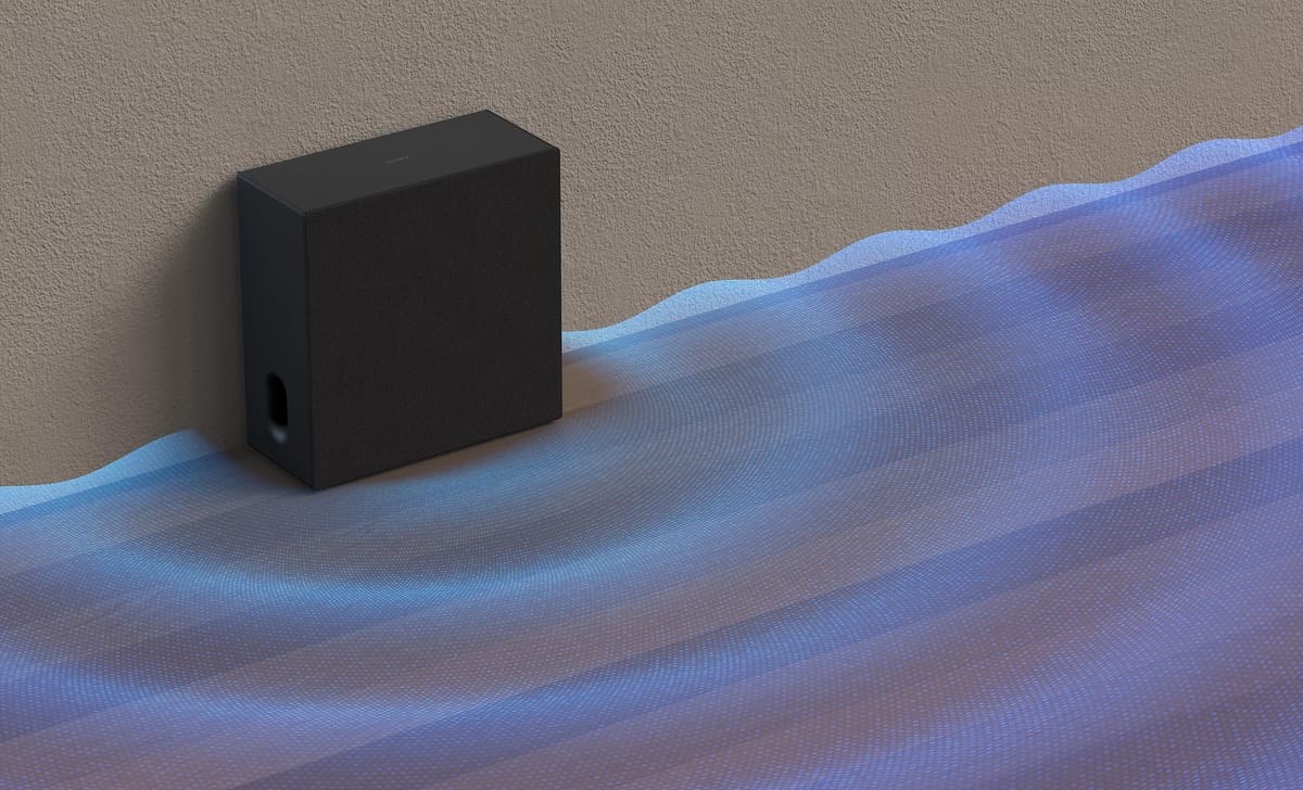 Lautsprecher mit visualisierten Schallwellen auf Boden.